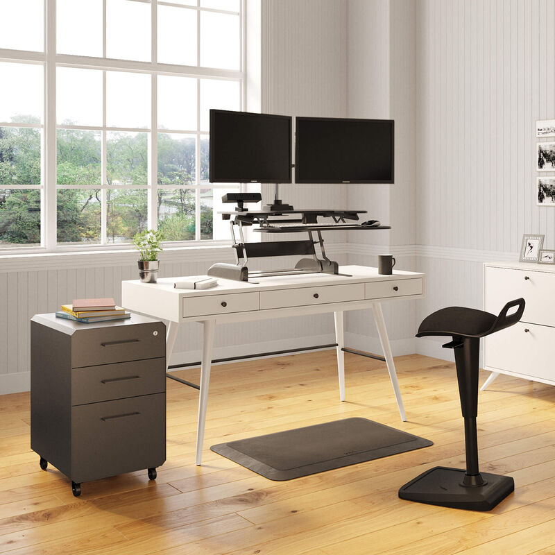 Sit-Stand Conversion Set in a home office setting includes, Varidesk Pro Plus 36, Dual-Monitor Arm, Active Seat, Standing Mat 34x20, Power Hub and a File Cabinet. image number null